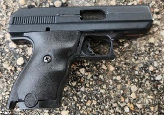 When the unidentified mother encountered the suspect, Cerry Rodriques Banks, police say he pulled his gun (pictured) and threatened the mother