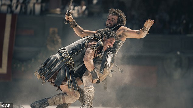 And Denzel wasn't alone, as the 86-year-old filmmaker also cut a same-sex kiss between Roman general Marcus Acacius (L, Pedro Pascal) and gladiator Lucius Verus (R, Paul Mescal)