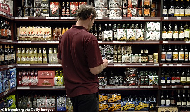 The four warehouses employ 1,500 people and serve hundreds of bottle stores, including many Dan Murphy's and BWS locations (pictured, a Dan Murphy's employee in Sydney)