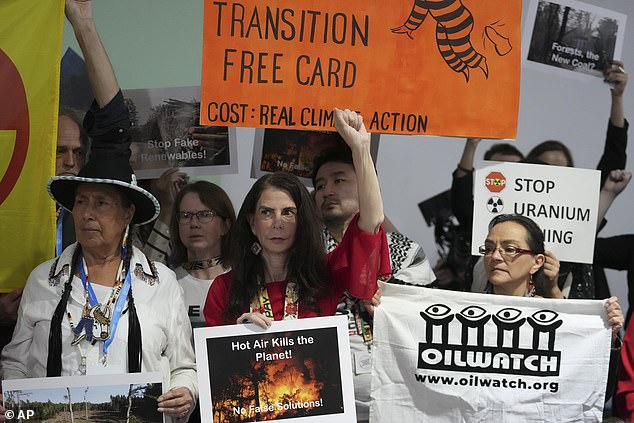 Activists take part in a demonstration today at the COP29 UN climate summit