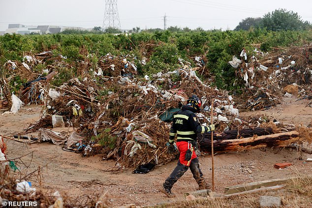 A soldier from the UME Special Emergency Corps searches for bodies after rain and flash floods caused rivers to overflow their banks in Valencia and other parts of Spain, in the Poyo ravine in Quart de Poblet, Valencia, Spain, November 13, 2024