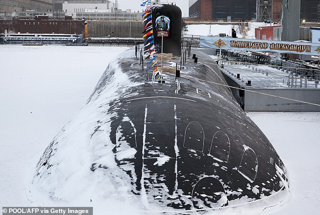 The new Russian nuclear submarine Alexander III is pictured during a flag-raising ceremony led by the Russian President in the Arctic port of Severodvinsk on December 11, 2023