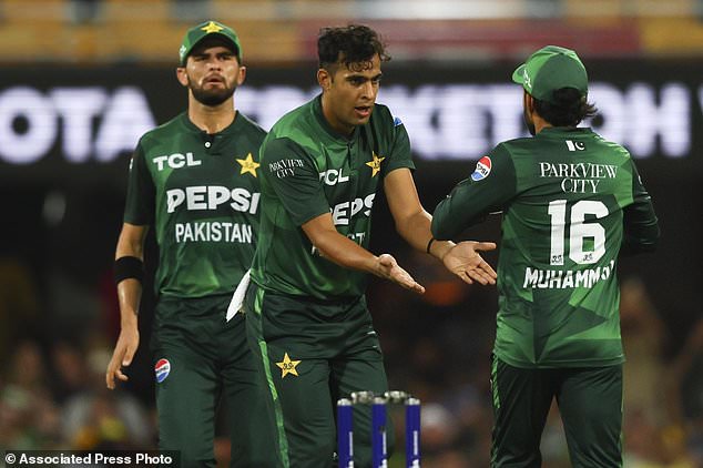 Pakistan's Abbas Afridi celebrates with teammate Mohammad Rizwan, right, after dismissing Australia's Glenn Maxwell during the T20 cricket international between Pakistan and Australia at the Gabba in Brisbane, Australia, Thursday, November 14, 2024. (AP Photo/Tertius Pickard)