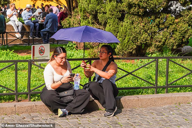 According to the National Oceanic and Atmospheric Administration (NOAA), the average global temperature last month was 15.32°C. Pictured: People in Rome during a period of humid weather, October 22, 2024