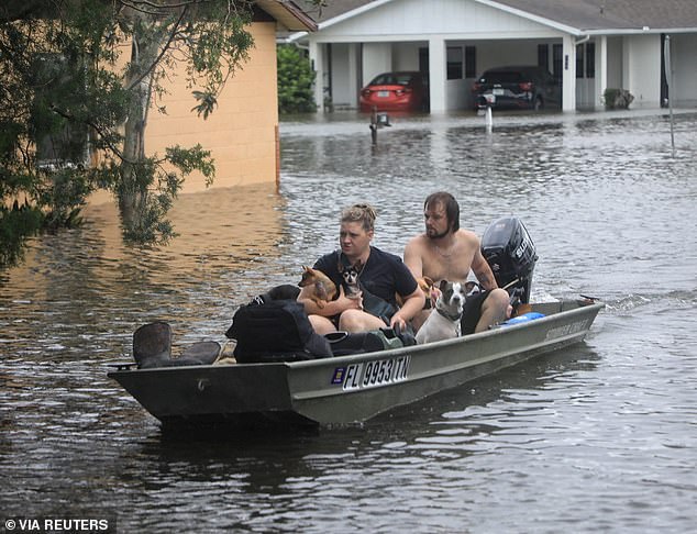 Hurricane Milton killed 35 people in the US and Mexico. Pictured, residents and their pets evacuate in South Daytona, Florida, October 10, 2024