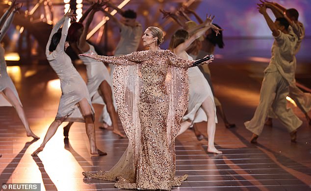 Dion, 56, dazzled in a pink glittering dress as she performed The Power Of Love and I¿m Alive.