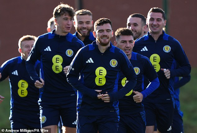 Andy Robertson leads the Scotland squad through their paces during training ahead of the match against Croatia