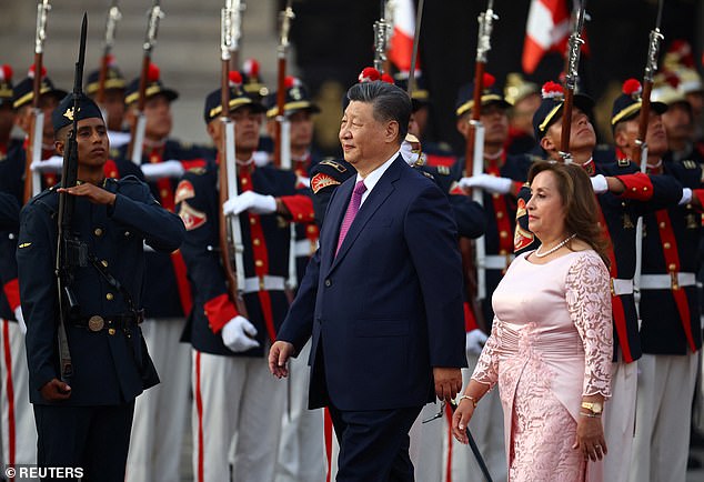 Chinese President Xi Jinping reviews the guard of honor together with Peruvian President Dina Boluarte