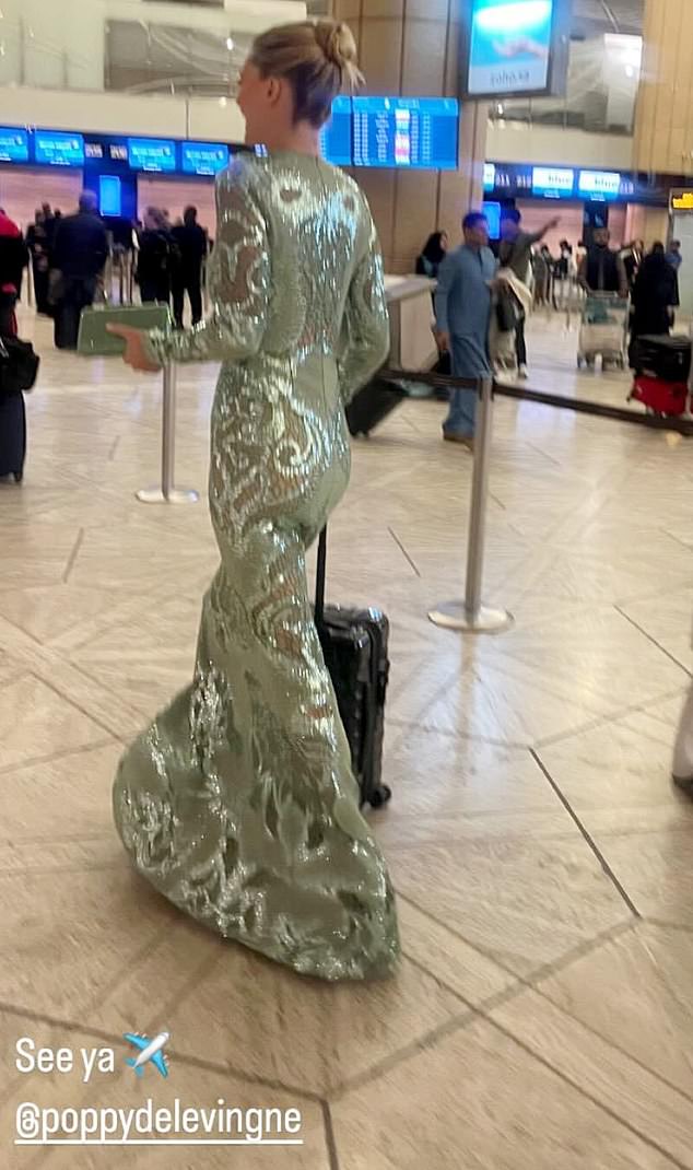 The 38-year-old model was spotted in a departure lounge in Saudi Arabia on Wednesday evening, still wearing an embellished dress