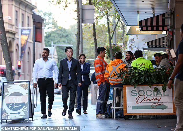 Australian workers could soon get two months' service leave, even if they don't stay with the same employer for 10 years, under a radical new plan (pictured, Sydney workers)