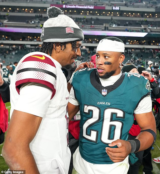 Washington Commanders quarterback Jayden Daniels (L) and Barkley (R) after the game