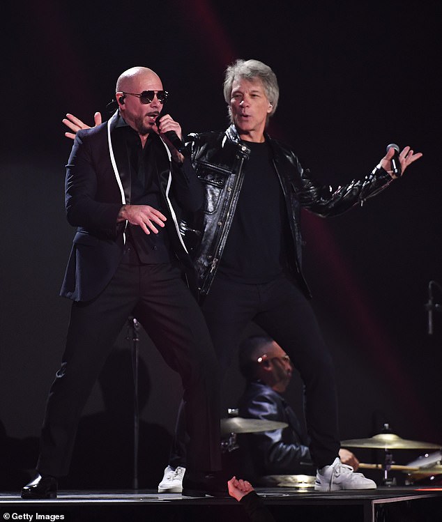 Bon Jovi performed on stage alongside Miami-born music artist Pitbull, 43, as they sang their new collaboration Now or Never