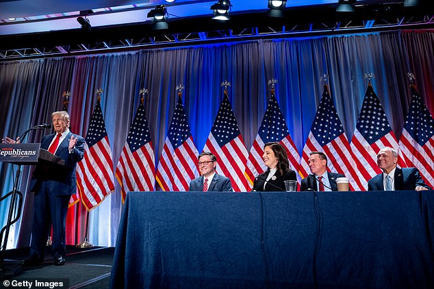 President-elect Donald Trump, joined on stage by House Speaker Mike Johnson and House Republican Conference Chair Elise Stefanik, addresses House Republicans on Wednesday