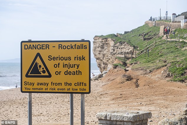 Warning signs have been placed on Hive beach, outside Burton Bradstock, urging people to 'stay away from the cliffs'