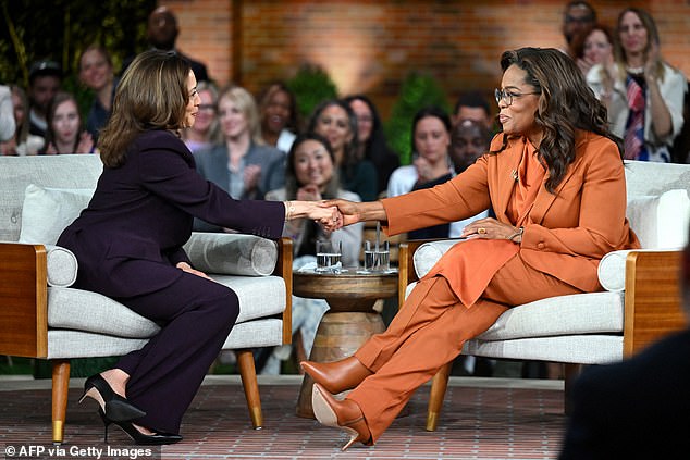 Vice President and Democratic presidential candidate Kamala Harris (L) joins media titan Oprah Winfrey during a live-streamed 'Unite for America' rally in Farmington Hills, Michigan, on September 19, 2024