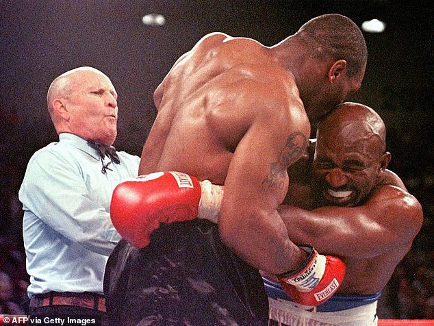 King references how he stood by Tyson after he was disqualified for biting Holyfield's ear, and says he's now buried the hatchet with Iron Mike