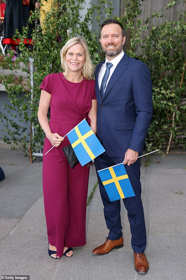 Swedish Prime Minister Ulf Kristersson said on Thursday that Brandberg's problem had not affected government work. Pictured: Brandberg and a guest attend the Swedish National Day celebrations on June 6, 2024 in Stockholm