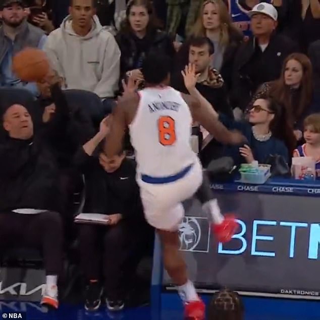 The Devil Wears Prada star, 42, was pictured sitting courtside as the 6-foot-2 NBA player, 27, charged toward her while chasing the ball during a game between the New York Knicks and Chicago Bulls