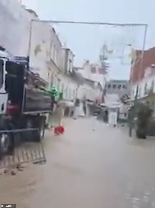 Photo shows flash flooding in Albufeira in the Algarve yesterday morning