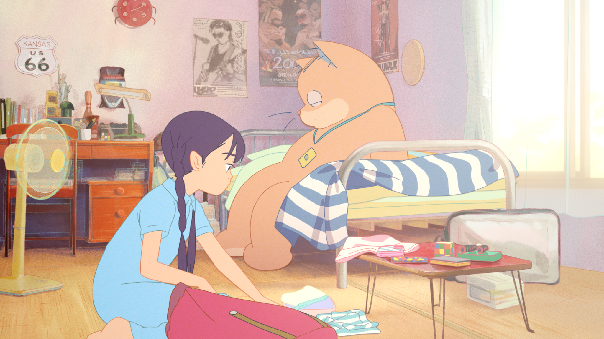 Purple-haired 11-year-old anime character Karin packs a bag while Anzu, a giant orange cat, sits on a bed behind her in Ghost Cat Anzu