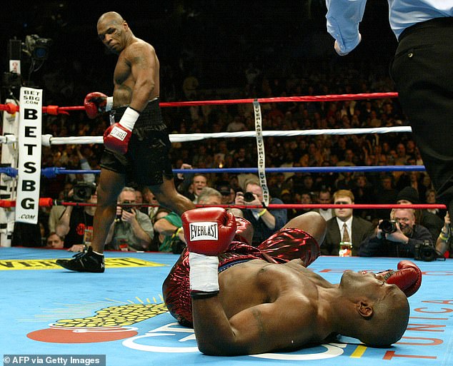 For any boxer, facing Mike Tyson in the ring is an experience few forget, especially when it comes to his punching power (photo - Tyson looks back at Clifford Etienne in 2003)