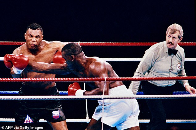 Buster Douglas (center) famously defeated Tyson in one of the biggest upsets in boxing history, but he still noted that Tyson's power was unlike anything else he had encountered