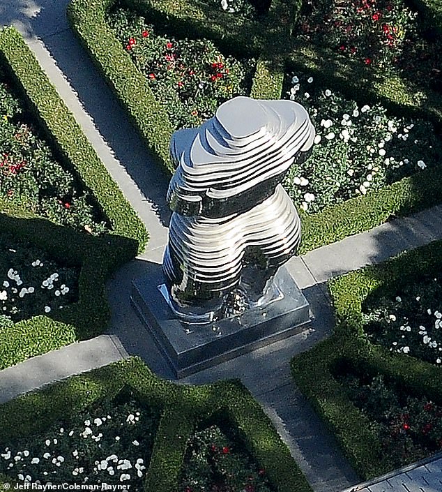 The 6-metre-tall chrome statue stands in the formal gardens of Diddy's country home in Holmby Hills