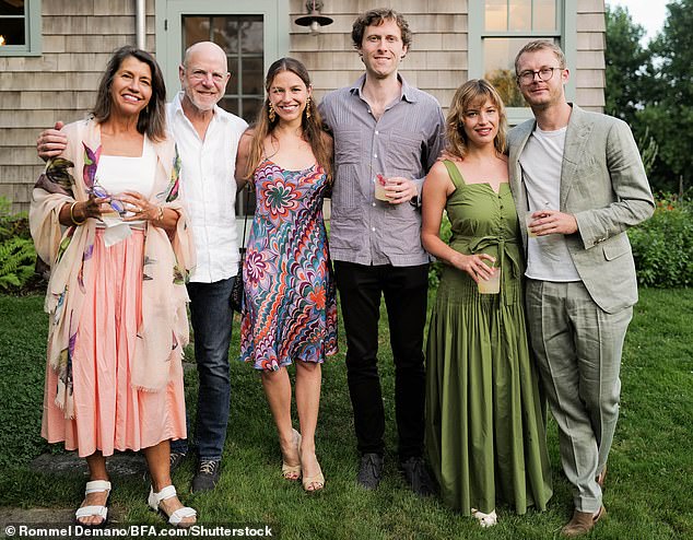 Photos taken at parties in the Hamptons show him working with, among others, award-winning architect Ted Flato, seen here second from left next to Henry, center