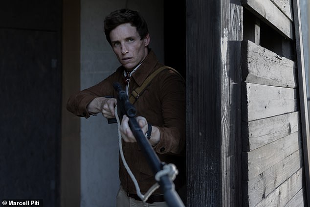 Redmayne wields a gun as the lone killer The Jackal