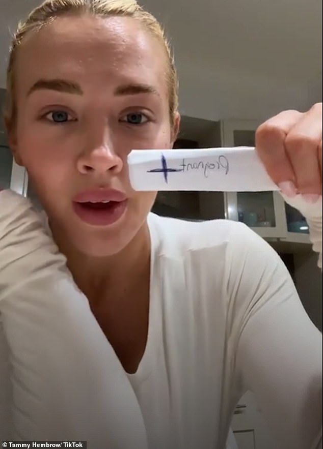 The fitness influencer, 30, took to TikTok to post a video of herself showing off a positive pregnancy test