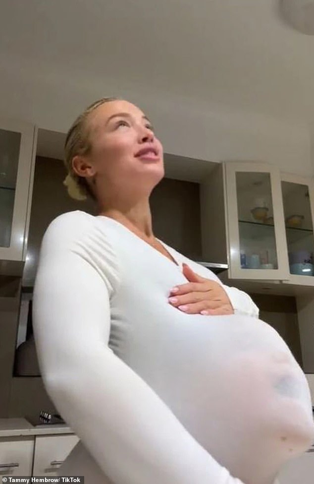 The creator of the TammyFit app then revealed a 'baby bump' that turned out to be her eight-year-old son Wolf under her shirt