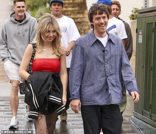 Tim, 43, looked like Liam Gallagher's doppelgänger with a modern haircut, complete with a pinstripe jacket, white T-shirt, black cuffed trousers and Dr. Martens boots