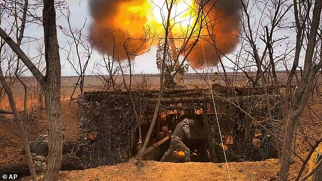 A Russian Giatsint-b gun fires on Ukrainian positions at a secret location in Ukraine, on November 19, 2024