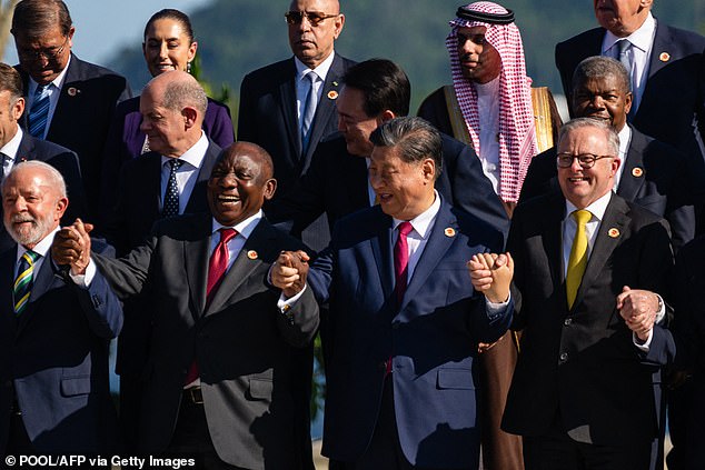 Other leaders, including Brazilian President Luiz Inacio Lula da Silva, South Africa's Cyril Ramaphosa, Chinese President Xi Jinping and Australian Prime Minister Anthony Alabanese, grinned during the group photo