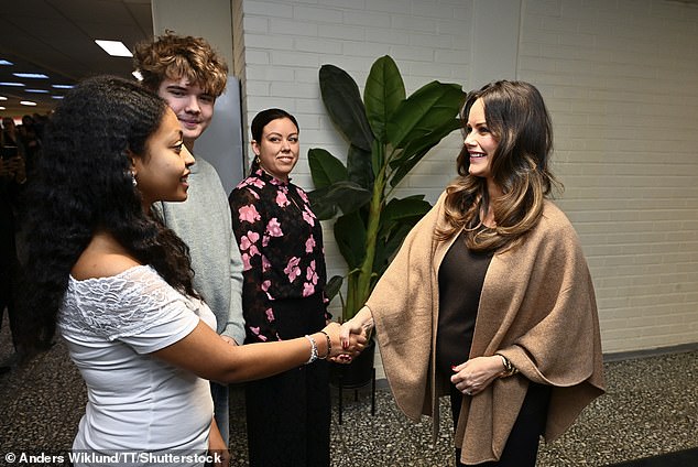 The royal also had the chance to chat with students and was pictured shaking hands and chatting with a group of young people at Gränby School