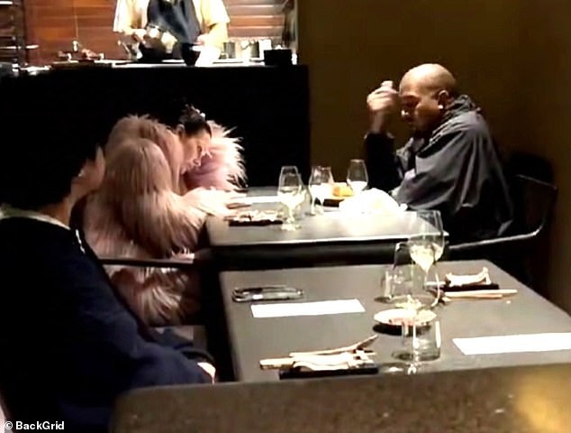 The 47-year-old rapper-designer and his 29-year-old Yeezy head of architecture looked a little bored or tired as they studied the menu