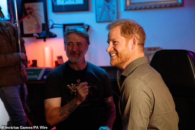 The Duke of Sussex (pictured right) during a 'tattoo' sketch with Jelly Roll (not pictured) at New York tattoo parlor East Side Ink, to promote the 2025 Invictus Games, to be held in Vancouver and Whistler in February