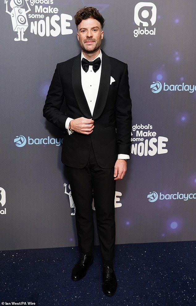 Capital Breakfast host Jordan North looked dapper in a black and white tuxedo as he posed for photos on the red carpet