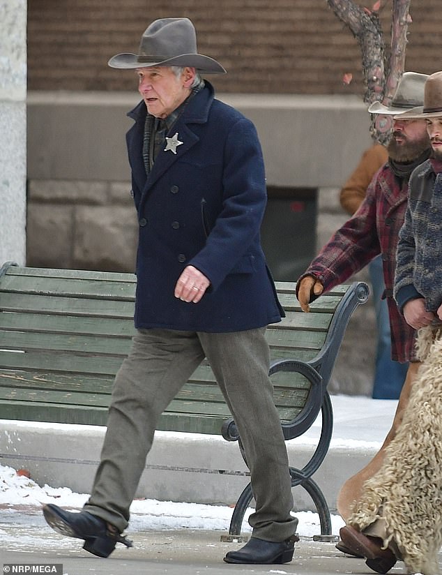 Ford wore a dark blue double-breasted jacket that buttoned at the front, as well as olive green pants