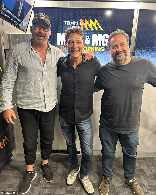 The NSW State of Origin legend and breakfast show co-host was reportedly told the news by his 'Melbourne boss', who traveled to Sydney to deliver it in person. Pictured left with Merrick Ross (center) and co-host Mick Molloy (right)