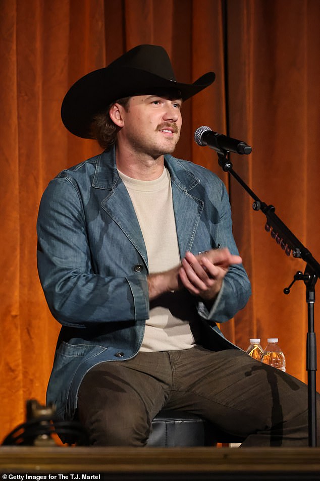 The video also revealed she was involved with country superstar Morgan Wallen, 31, who 'hurt her feelings' but 'she kept going back'; Red Light District pictured in September