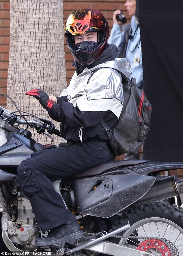 Later, the Oscar-nominated actor donned an iridescent helmet as he prepared to leave on his bike