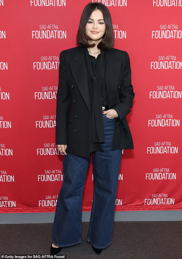 She teamed the look with high-waisted jeans and a pair of simple black heels, while wearing her dark hair down on her last night out on the town.