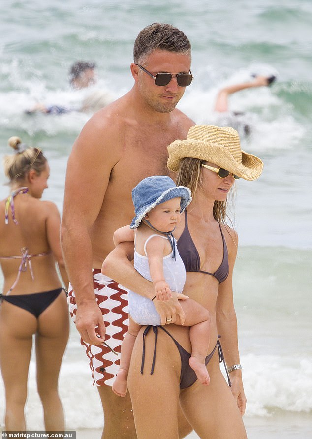 Lucy went for a western beach theme and wore a cowboy-style straw hat and dark sunglasses