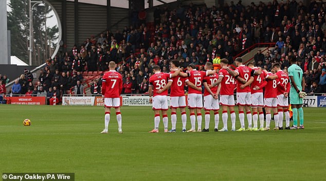 McClean stood apart from his Wrexham teammates and observed a moment of silence during the memorial weekend