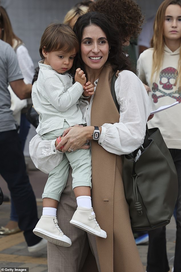 Rafa Jr was dressed in light green chinos with a matching striped shirt and impeccable cream high-top sneakers