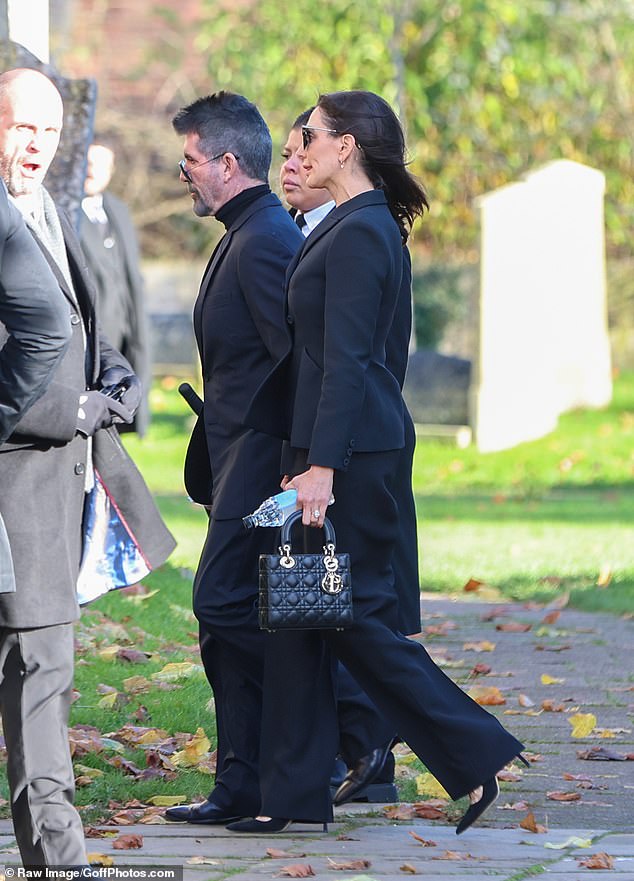 Cowell arrived at the funeral with his wife Laura Silverman