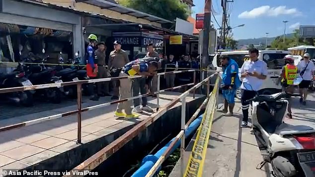 Shocked locals spotted the body floating face down in the shallow water at around 9am this morning