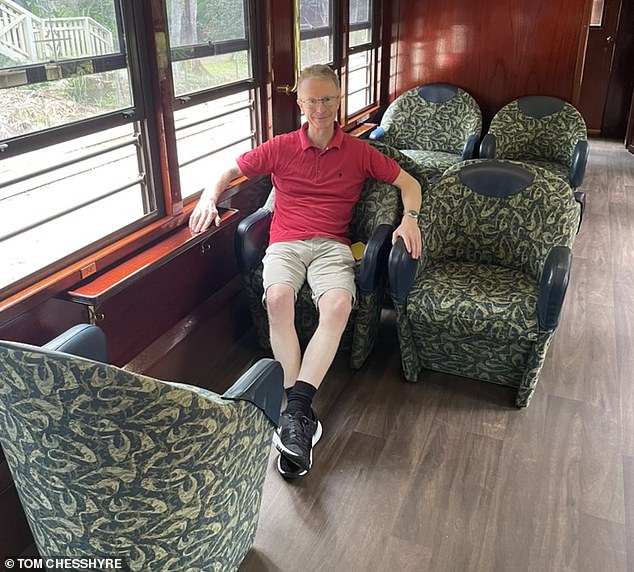 Tom is pictured above in a Gold Class carriage, fitted with 'chic' green and gold armchairs