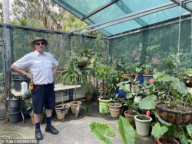 Station master Paul in the greenhouse of the Kuranda station. 'How many stations have such a station?' Tom notes